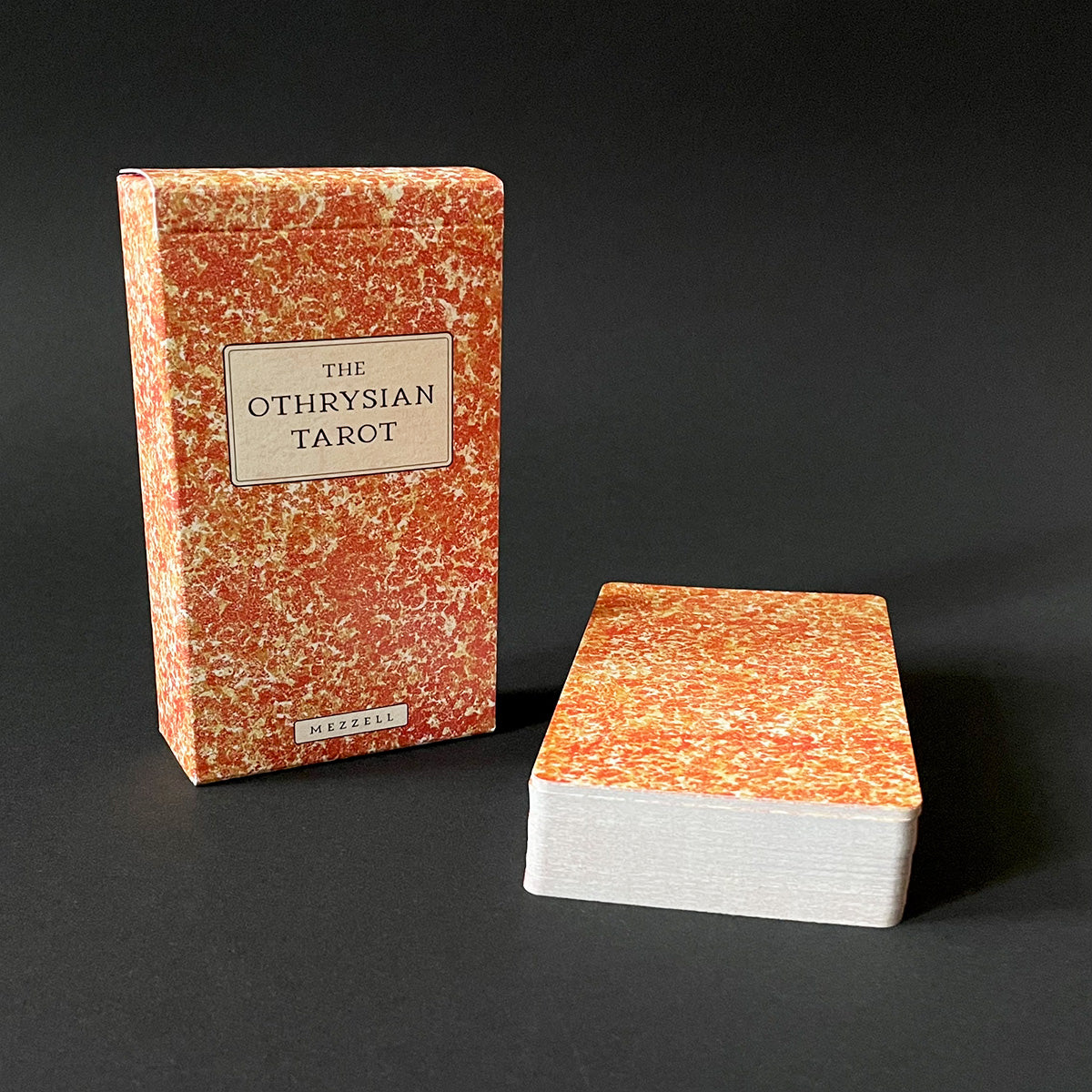 Othrysian Tarot book and card deck on a black background