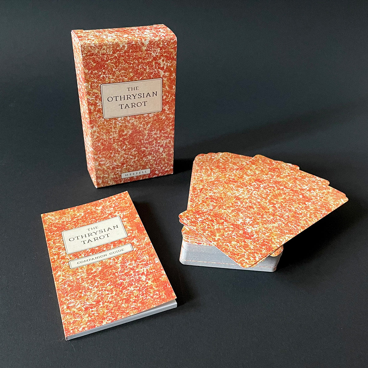 Othrysian Tarot cards with packaging on a dark background