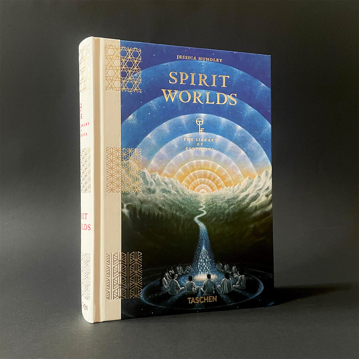Book titled 'Spirit Worlds' by Jessica Hundley with a dark gray background