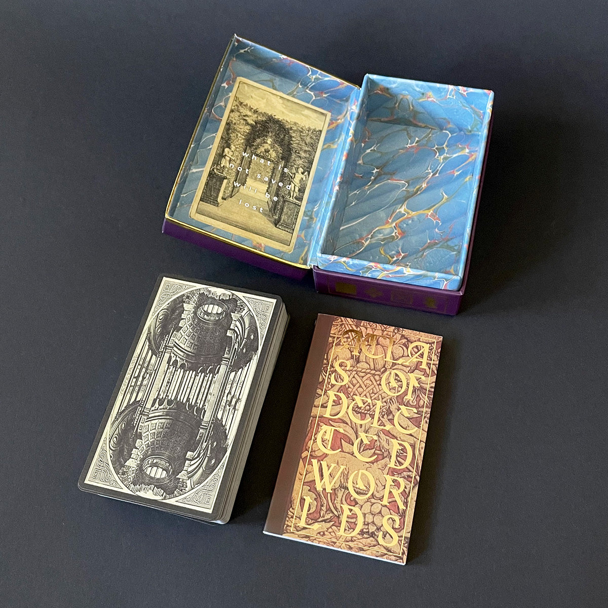 Decorative card box with two cards on a dark background