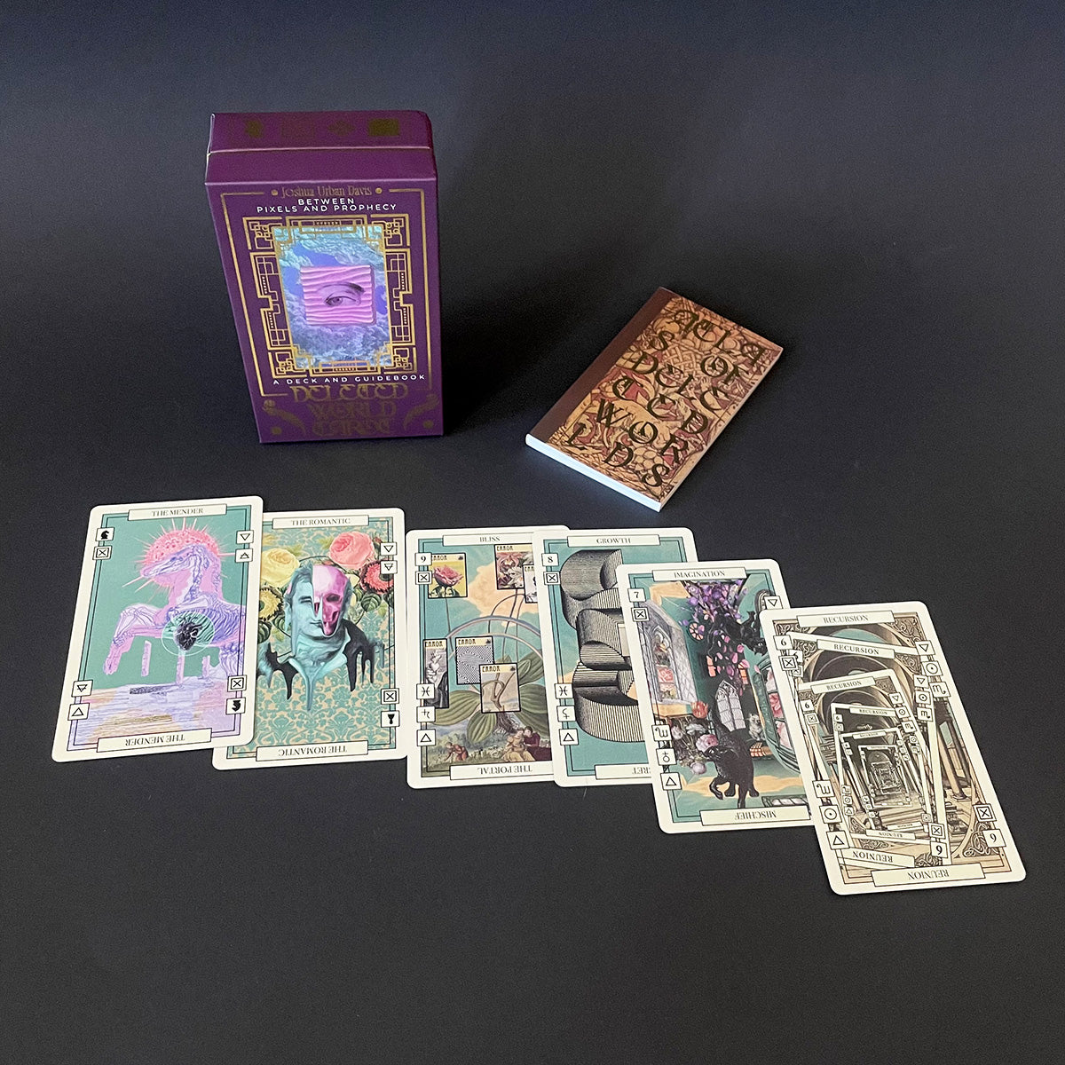 Collection of tarot cards and a purple box on a dark background