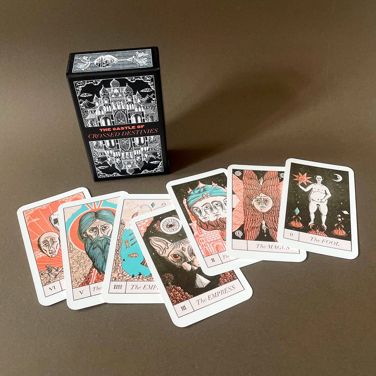 Collection of tarot cards and a box on a dark background