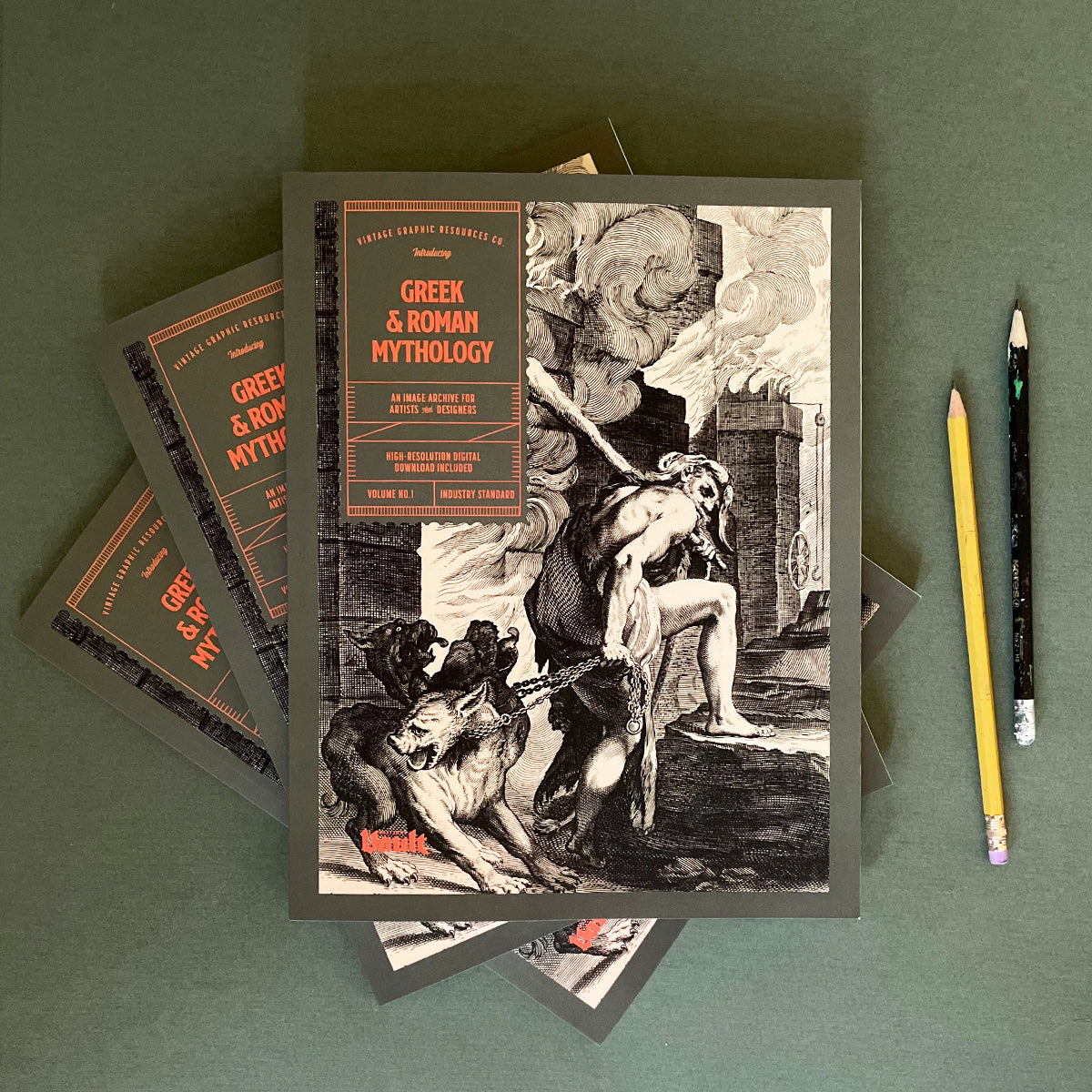 A magazine titled 'Greek and Roman Mythology' showing an illustration of Theseus and the minotaur on the cover, accompanied by pencils and a notebook.